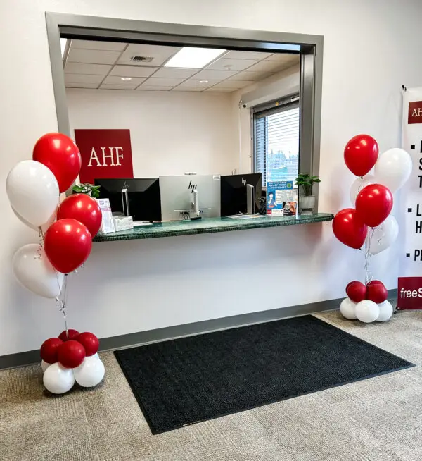 Helium balloon bouquets with balloon bases decorating the entryway and halls at ACH Tacoma.